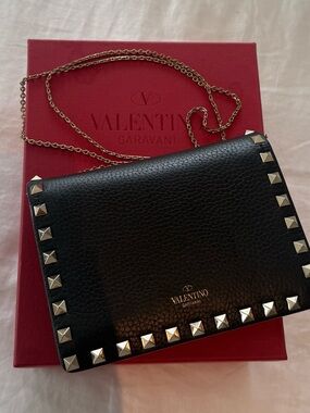 Valentino Garavani Black Pebbled Leather Rockstud clutch with Gold Chain